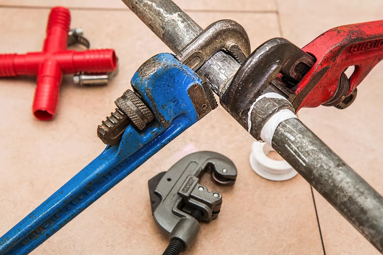 Pipe wrenches on residential piping during a repair